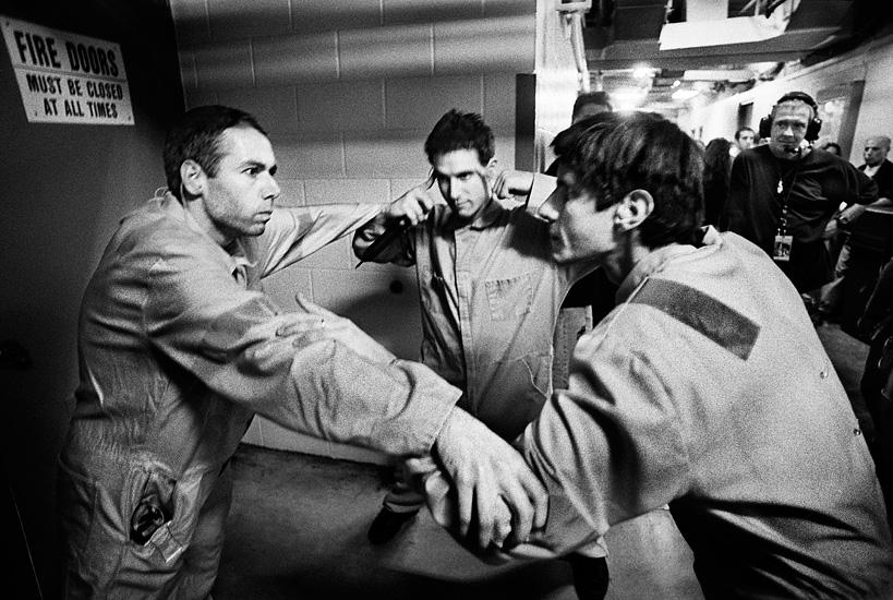 Beastie Boys backstage huddle: equal parts game plan, mischief, and inside jokes.